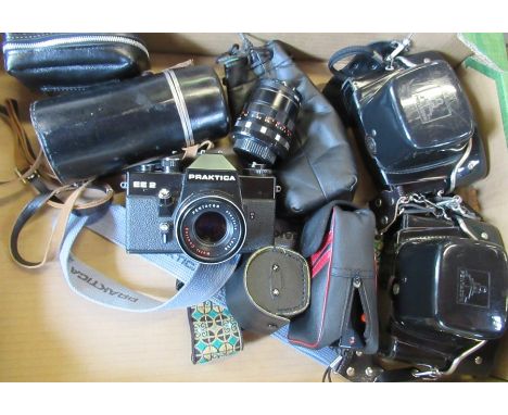 A Praktica camera, together with other cameras, lenses etc