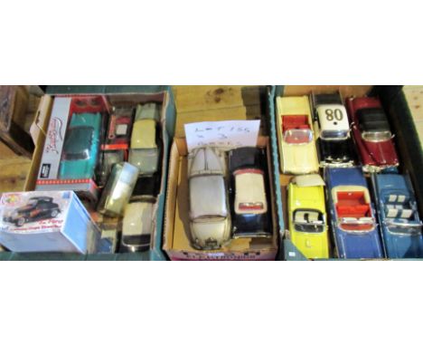 Three boxes containing a collection of die-cast large scale model vehicles, largely modelled on 1960's American saloon and ot