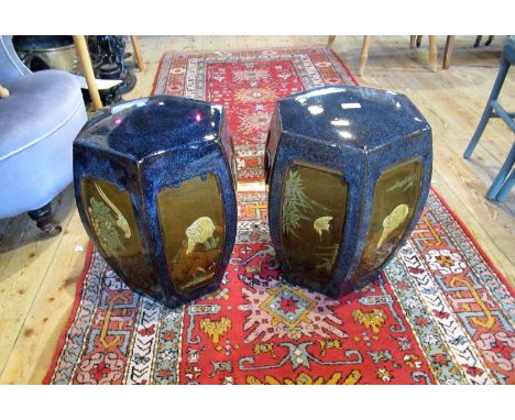 A pair of reproduction Oriental ceramic garden seats of traditional form.