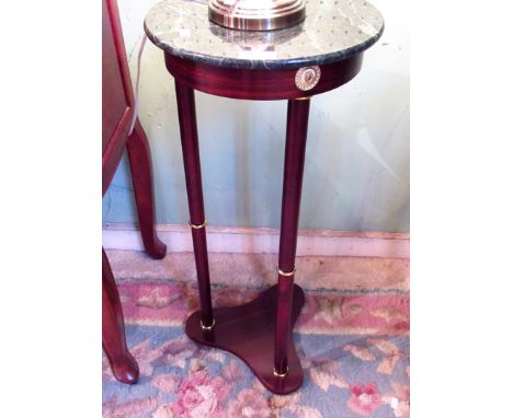 A reproduction French-style lamp table, the simulated circular marble top on three column supports and trefoil plinth, 70cm.