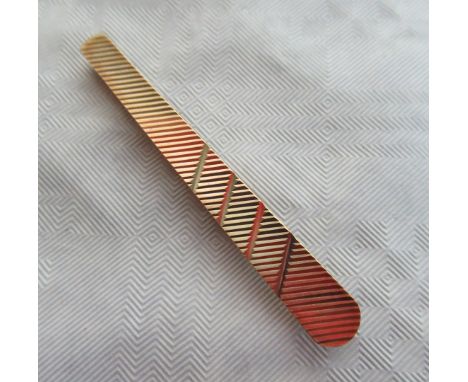 A 9ct gold engine turned tie pin. Condition Report: 6.5 grams.