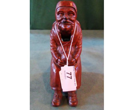 A Continental boxwood nut cracker, fashioned as an elderly seated lady, with hinged jaw.