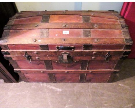 A 19th century gentleman's dome top wood banded cabin trunk, with well fitted tray lined interior.