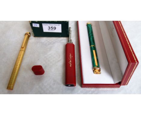Must de Cartier.  A cased gold plated ball point pen with refills, together with a Cartier gold plated ball pint pen with eng