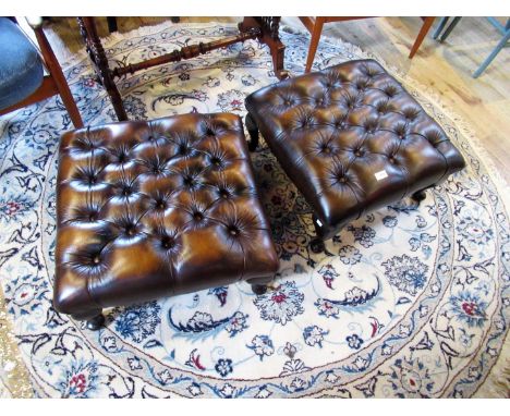 A pair of button hide upholstered footstools, each on cabriole legs. Condition Report: Good condition.