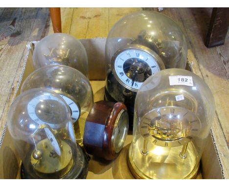 Six 20th century mantle timepieces, including: a wooden cased clock with easel support and five others, beneath glass/plastic