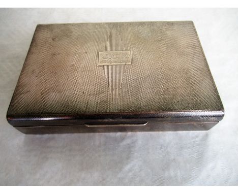 A silver cigarette box, the engine turned hinged rectangular lid initialled JCK and inscribed 'Christmas 1954', Birmingham ma