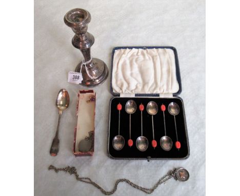 A cased set of bean terminal coffee spoons, a single silver table candlestick with loaded base, a silver Hanoverian pattern t