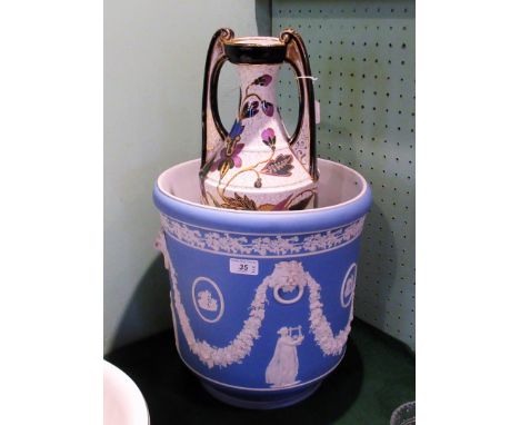 A large Wedgwood Jasper-style jardiniere, decorated with lions mask swags of fruiting vines and classical figures, together w