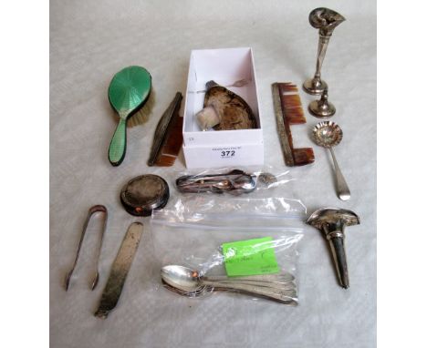 A mixed lot of small silver items, including: single stem trumpet shaped vase, sugar nips, sifter spoon, two silver backed co