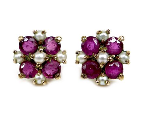 A pair of 9ct gold, ruby and pearl stud earrings, of quatrefoil design, 1.1 by 1.1cm, hallmarked to posts, 2.7g. 
