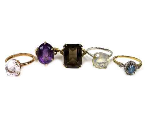 A group of five dress rings, comprising a 9ct gold ring set with an emerald cut smoky quartz, 16 by 12 by 8mm, size L, 5.0g, 