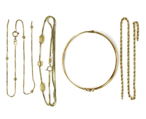 A 9ct gold bangle with engraved leaf decoration, 6cm inner diameter, together with a 9ct gold necklace with gold bead detail,