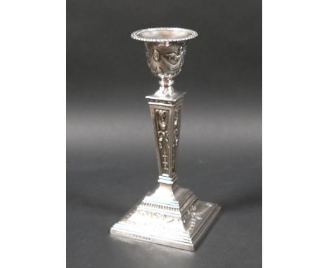 An ERII silver single candlestick, of stepped square section, with removable nozzle, decorated in Neoclassical style, A Marst