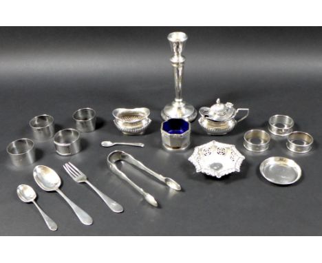 A collection of silver items, comprising a pair of George III silver sugar tongs, shell, fiddle and thread pattern, engraved 