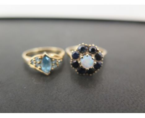 Two 9ct gold gem-set dress rings - To include opal and sapphire - Approx size N -Together with topaz - Size N 1/2 - Hallmarke