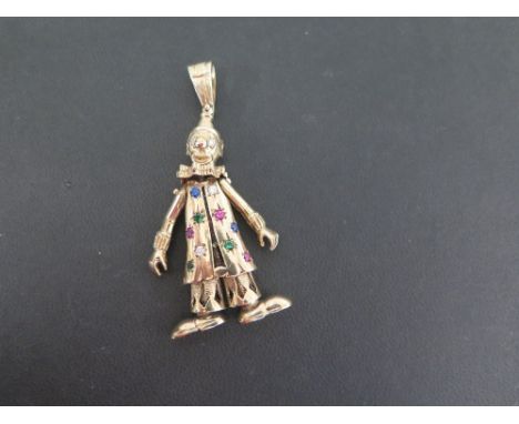 A 9ct gold articulated clown pendant - Set with vari-coloured paste - Hallmarked London - Length 7cms - Weight approx 20.9gms