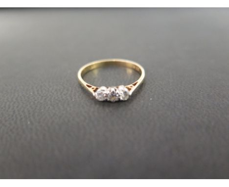 A brilliant-cut diamond three-stone ring - Stamped 18ct - Ring size O - Weight approx 1.7gms
Condition Report: Good - With li