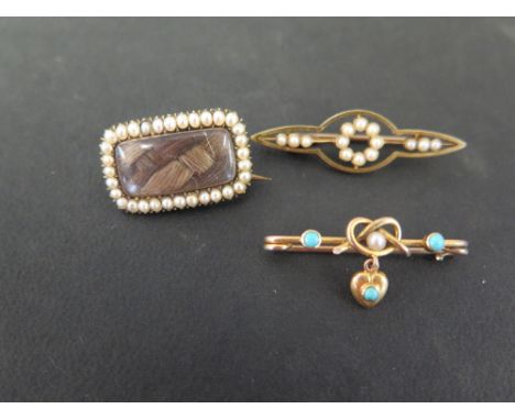 Three late 19th-early 20th century gold brooches - To include seed pearl and turquoise sweetheart brooch- A seed pearl memori