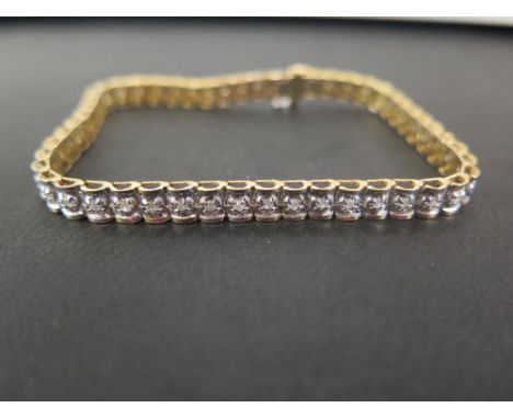 A bi-colour 9ct gold diamond panel bracelet - Estimated total diamond weight 1ct - Hallmarked Birmingham - Length 18.5cms - W