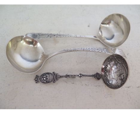 A pair of silver hallmarked Georgian sauce ladles, later decorated - London 1807-08 and a Continental decorated ladle - Weigh