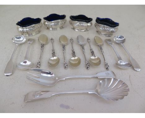 Seven silver hallmarked apostle spoons four mustard spoons, four salts with blue glass liners, a scallop shaped spoon and a f