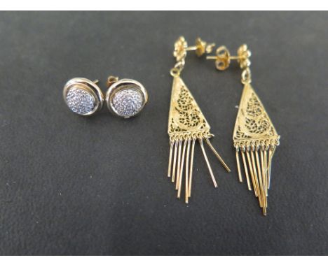 A pair of bi-colour diamond ear studs - Stamped 9K - Diameter 1cm - Weight approx 2.3gms - Together with a pair of filigree e