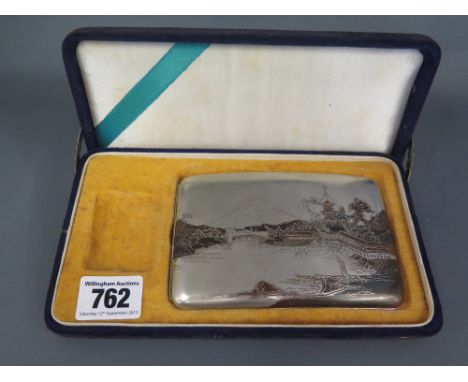 A Japanese sterling silver cigarette case approx weight 4 troy oz - some usage wear, opens and shuts with presentation box bu