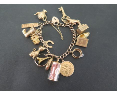 A 9ct gold curb-link bracelet suspending assorted charms - To include a George V 1914 half Sovereign coin - Hallmarked Birmin
