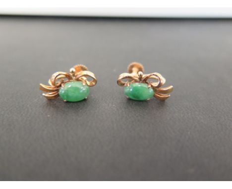 A pair of jade earrings - With screw-back fittings - Stamped 14K - Weight approx 5.1gms
Condition Report: Good - With light s