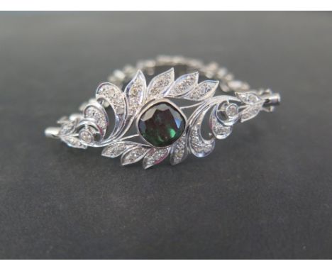 A Russian 14ct gold diamond and green-gem bracelet - The cushion-cut green gem, believed to be demantoid garnet, to the vari-