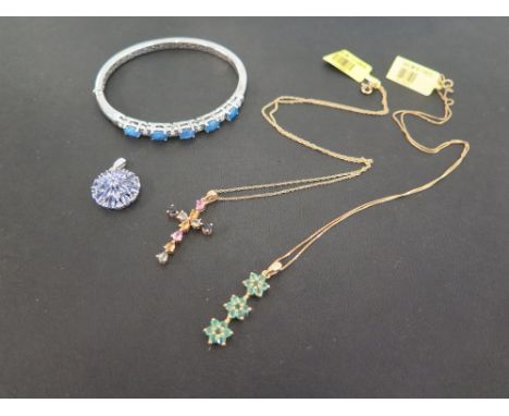 Three gem-set pendants - To include tanzanite and emerald - Together with an opal triplet hinged bangle - All with marks indi