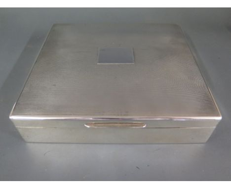 A large silver cigarette box - London 1934/35 maker R C - 16 cm x 17.5 cm x 4 cm 
Condition report:  Good condition, minor de