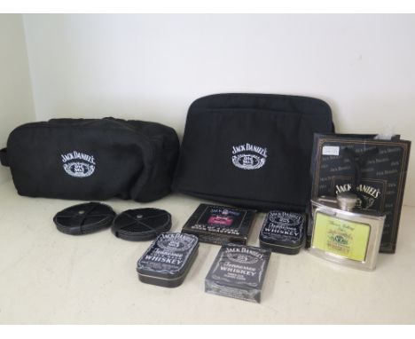 A selection of unused Jack Daniels old no. 7 collectable items to include wash bag, coasters, drinking flask and playing card