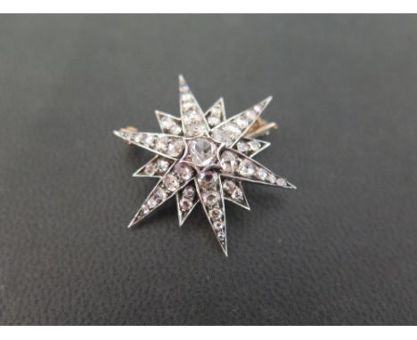 A late 19th/early 20th century gold and silver diamond star-burst brooch - Set throughout with rose-cut diamonds - Width 3.2c