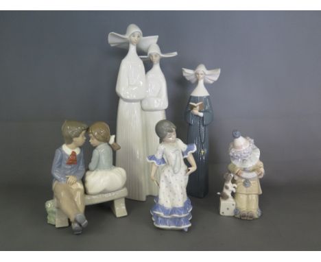 Four Lladro figures including No. 4611 - two Nuns, 5500 single Nun, Girl striking flamenco pose C-10-D, Clown with Poppy D-12