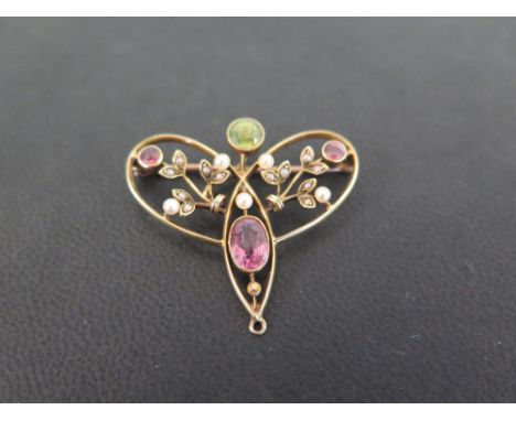 An early 20th century 15ct gold peridot, tourmaline and seed pearl brooch - Length 3.3cms - Weight approx 5.5gms
Good to fair