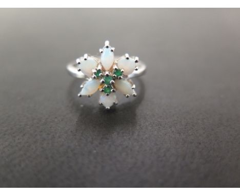 A 9ct gold opal and emerald floral cluster ring - Hallmarked Birmingham - Ring size N - Weight approx 3.0gms
Condition Report