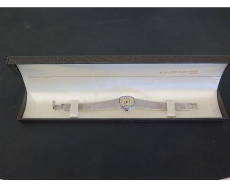 An 18 ct gold white gold diamond studded ladies FAVRE-LEUBA manual wind bracelet wristwatch - Weight approx. 38.5 grms 
Condi