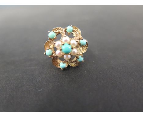 A 9ct gold turquoise and seed pearl openwork floral cluster ring - Hallmarked London - Ring size J (with sizing band) - Weigh