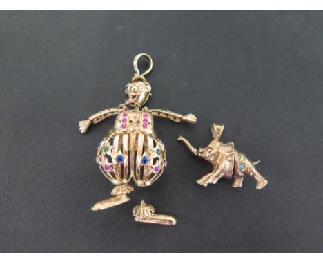 A 9ct gold articulated clown pendant - Set with vari-coloured paste - Hallmarked Sheffield - Length 6cms - Together with a 9c