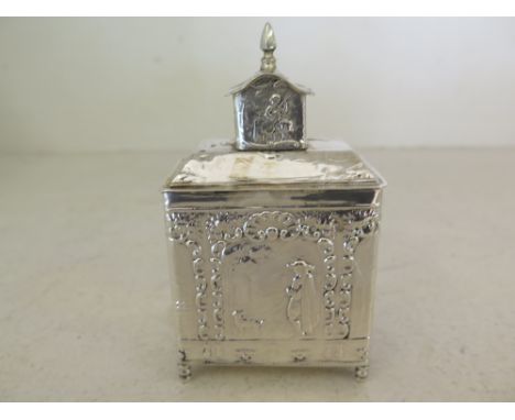 A Continental silver tea caddy and cover, embossed decoration landscape with figures - Weight approx. 3.76 troy oz