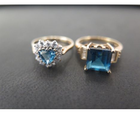 A 9ct gold topaz and diamond dress ring - Size O - Together with a topaz and CZ heart shape cluster ring - Ring size M - Both