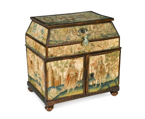 A Charles II stumpwork casket, of canted rectangular form and raised on squat bun feet, the hinged lid above two doors openin