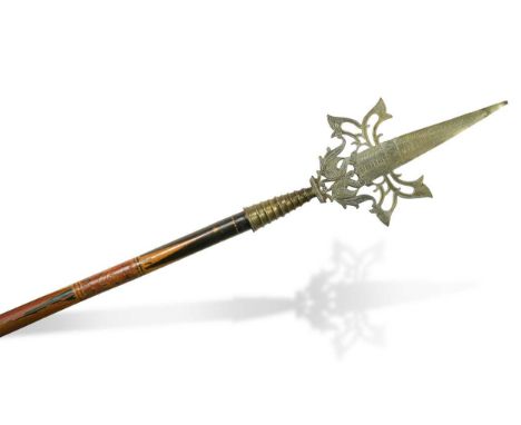 A decorative Eastern brass staff, late 19th century, with pierced peacock spear terminal, the pole shaft painted with foliate