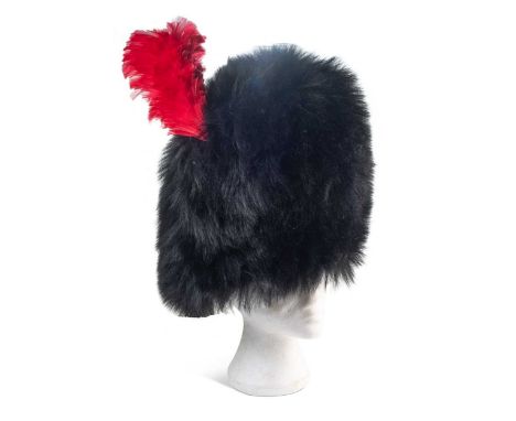 An Elizabeth II OR's ceremonial bearskin hat to the Coldstream Guards, with scarlet horse hair plume, wicker frame, leather l