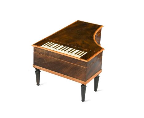 A Palais Royale mahogany sewing box-necessaire modelled as a pianoforte, 19th century,  with boxwood edging and mock ivory-ke