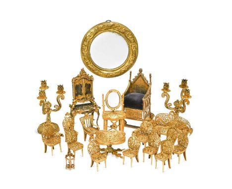 A collection of gilt metal dolls' house furniture, to include a pair of filigree three-branch candelabra, a filigree suite co