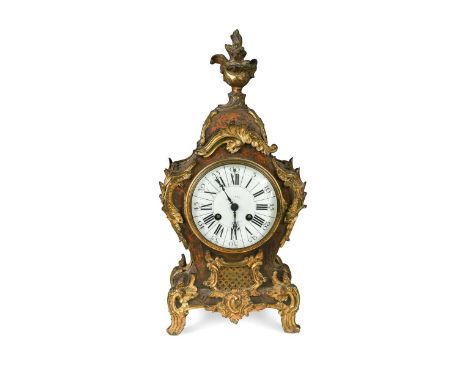A boullework mantel clock, 19th century,  with ormolu mounts and surmounted by a flowering urn finial, the white dial with Ro