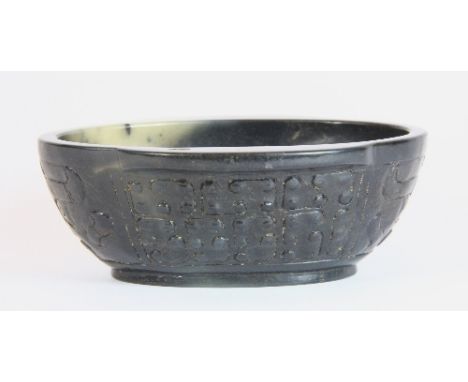 A Chinese dark green jade archaic form libation cup H11 x 9 x 4cm